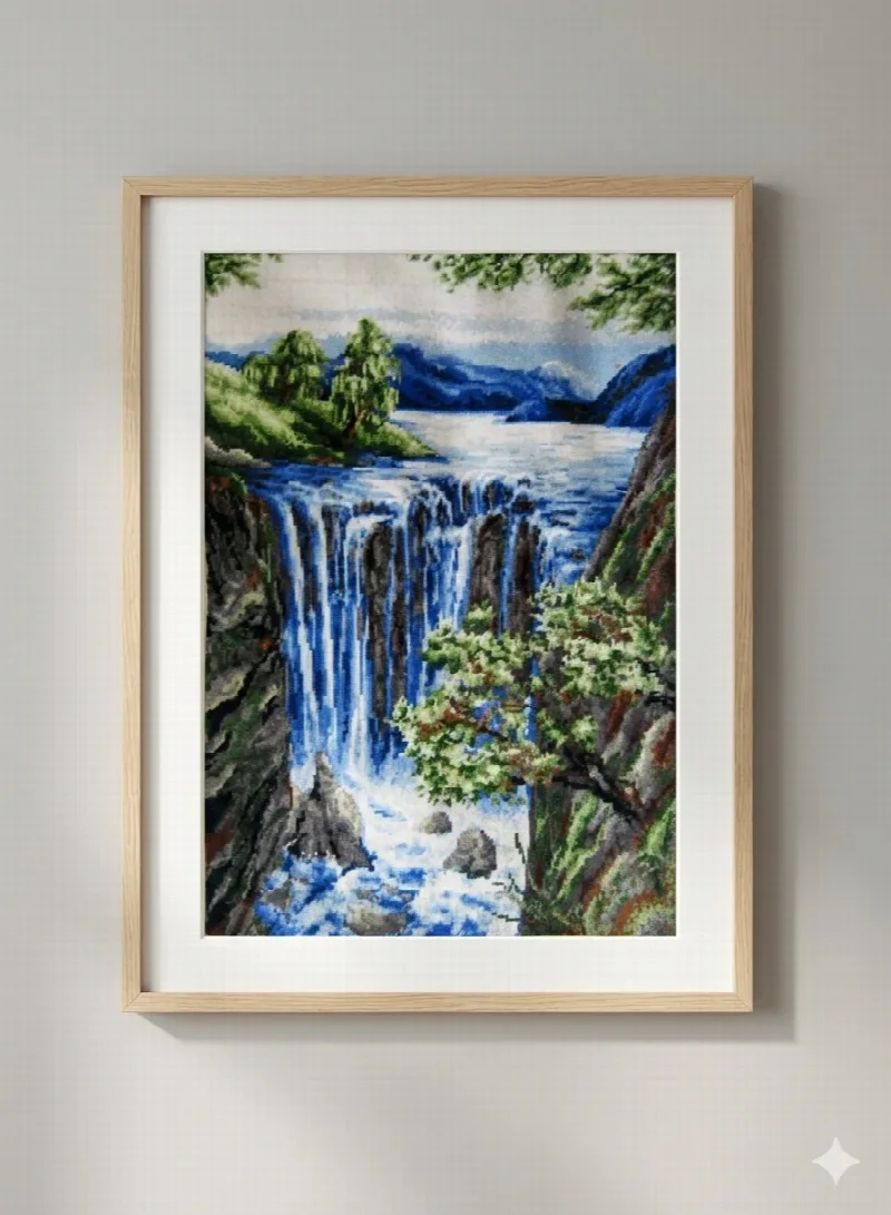 Blue waterfalls and rocky cliffs with a foreground tree, presented in a pale wooden frame