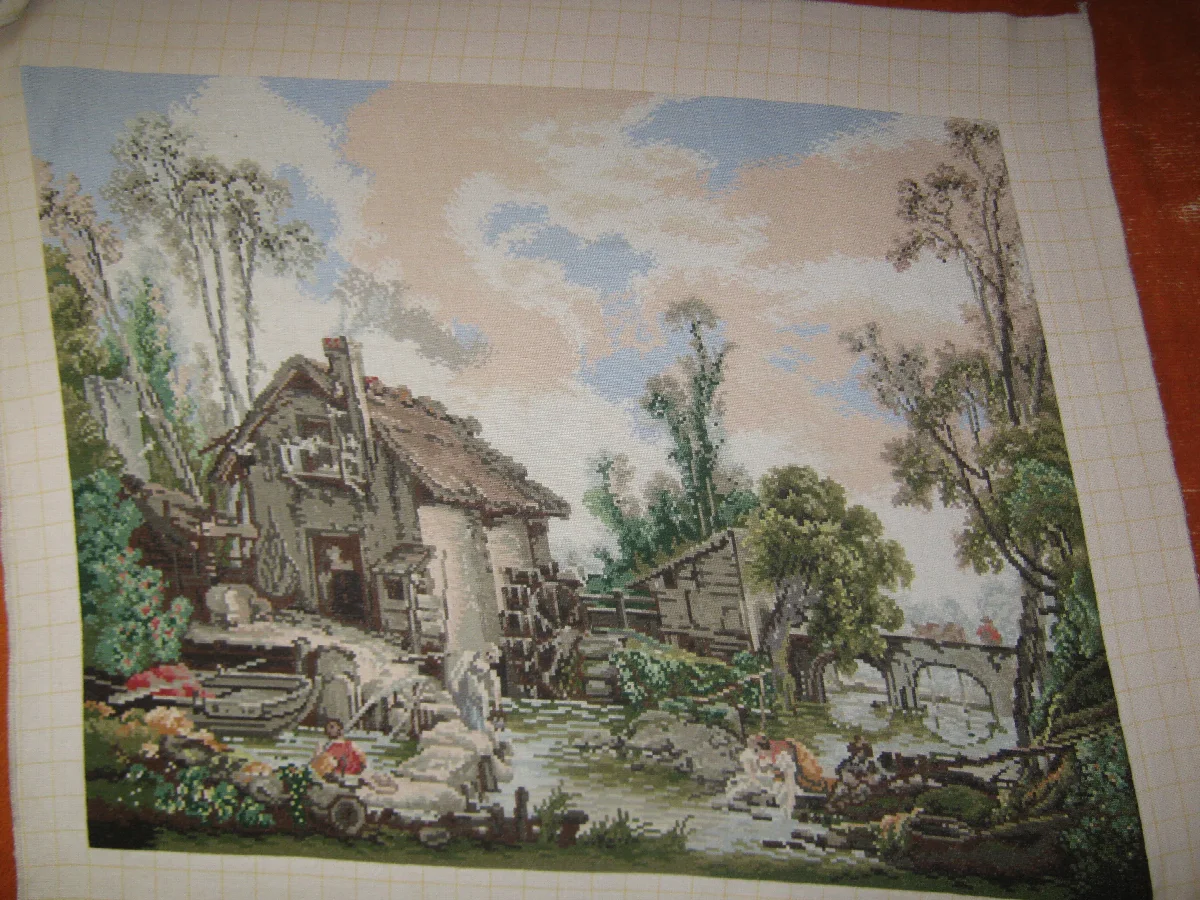 Unframed mill landscape with a sloping roof, stream and pale cloud-filled sky
